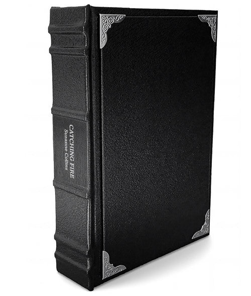 Catching Fire by Suzanne Collins - Luxury Gothic Leather-Bound Book - angled front-and-spine hero view